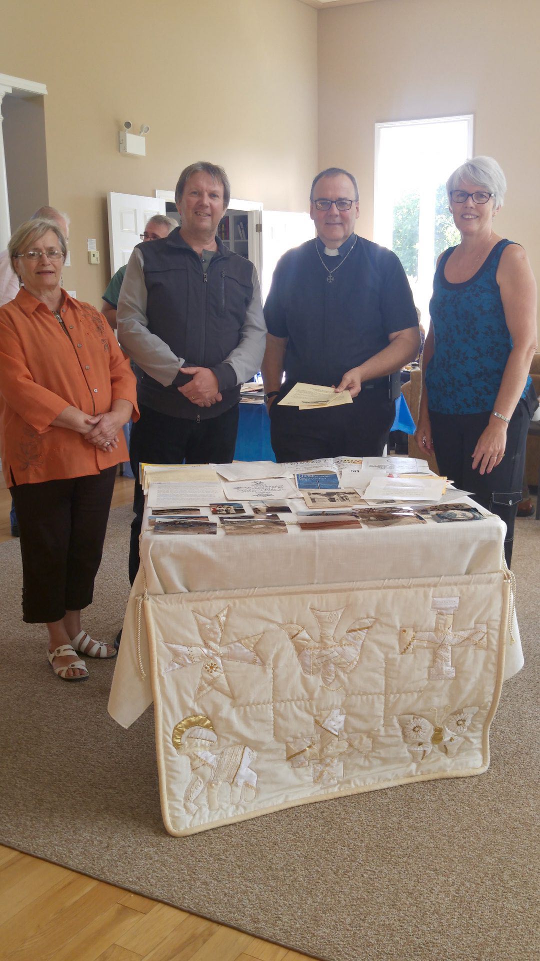 Churchwarden Reta Craig, Pastor Owen Ash, Canon Terry DeForest and Churchwarden Laurie Douglas were on hand to see what the pioneers of the past had sealed away in a capsule for the pioneers of today. Photo: Submitted by Laurie Douglas