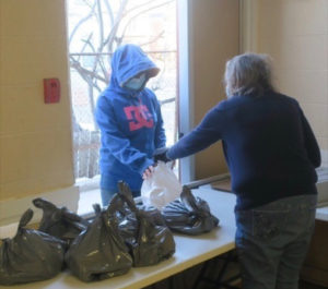 One of the program’s mentors serves breakfast and coffee to a guest