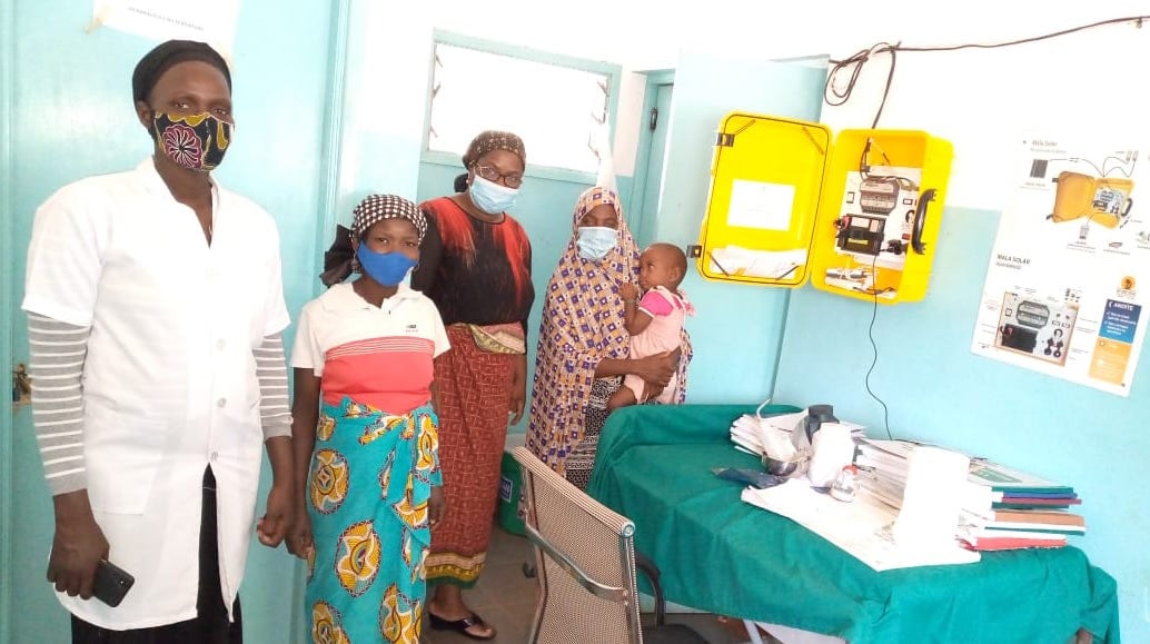 Nurse Cristina Kaunda Quilossa, far left, says the solar suitcase makes delivering babies much easier and safer. (Photo: PWRDF.org)