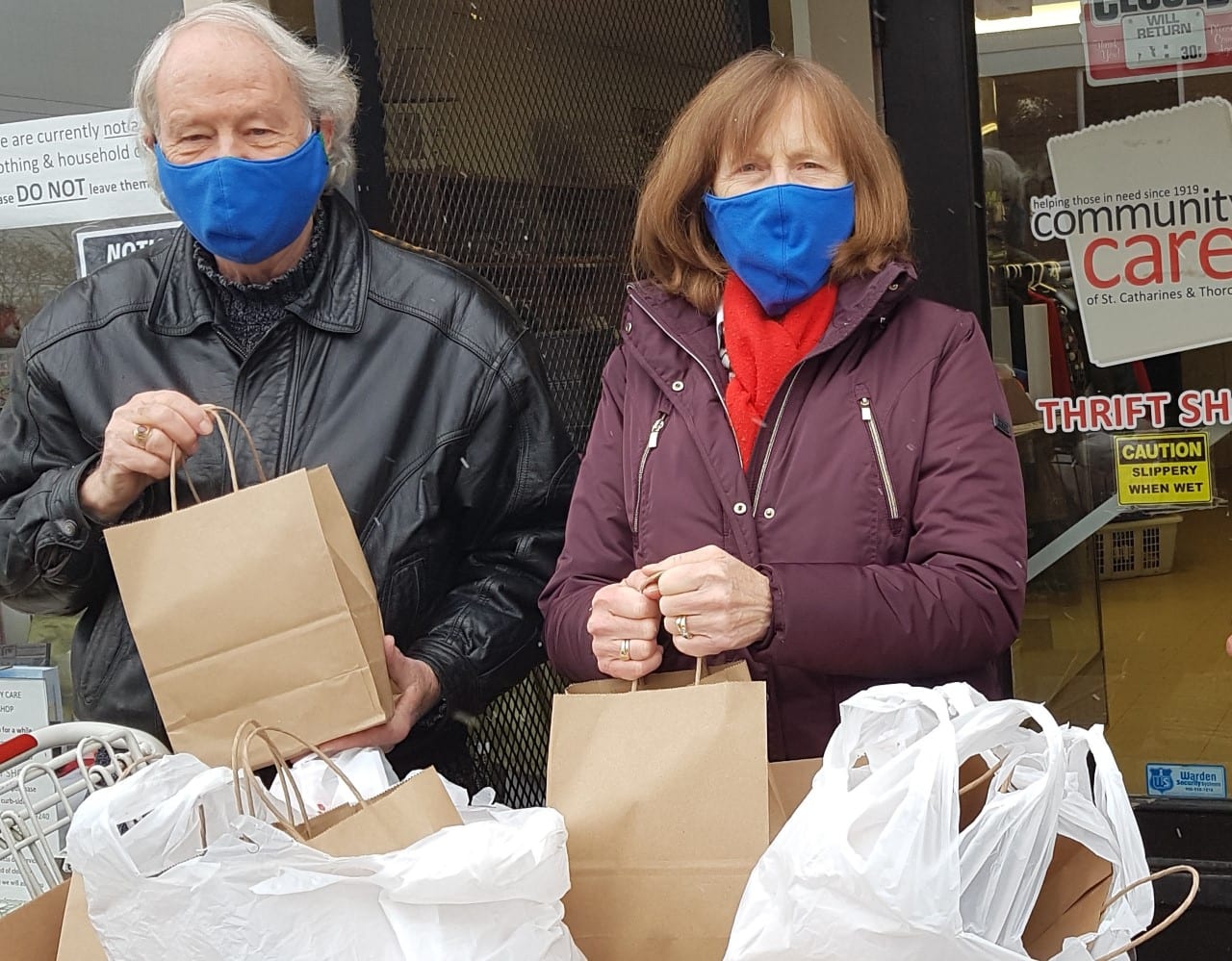 Wayne Fraser and Eleanor Johnston, volunteers from Anglicans in Action, pack bags for distribution to vulnerable citizens. Photo: Contributed by Diane Kidson.