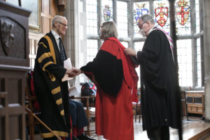 Bishop is hooded for honorary degree