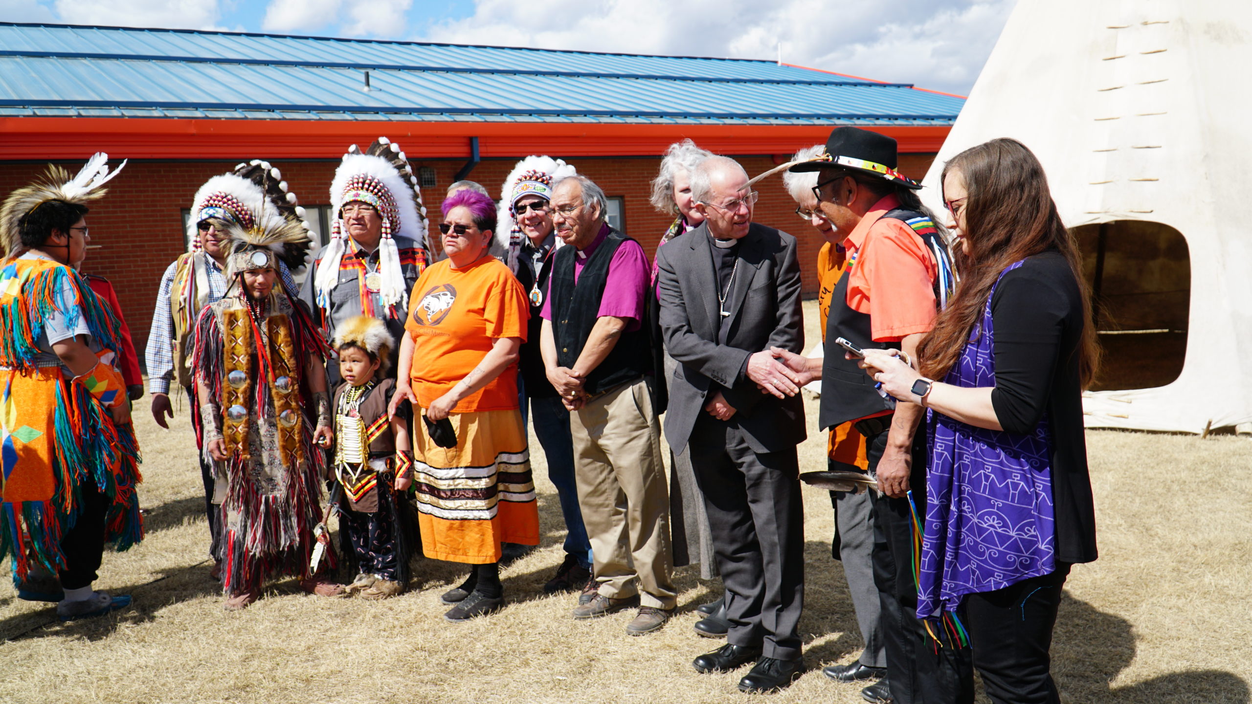 Archbishop Welby stands with a group of Indigenous leaders in Prince Albert, Saskatchewan